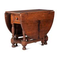 A Swedish Turned and Block Carved Pine Drop-Leaf Gate-Leg Dining Table