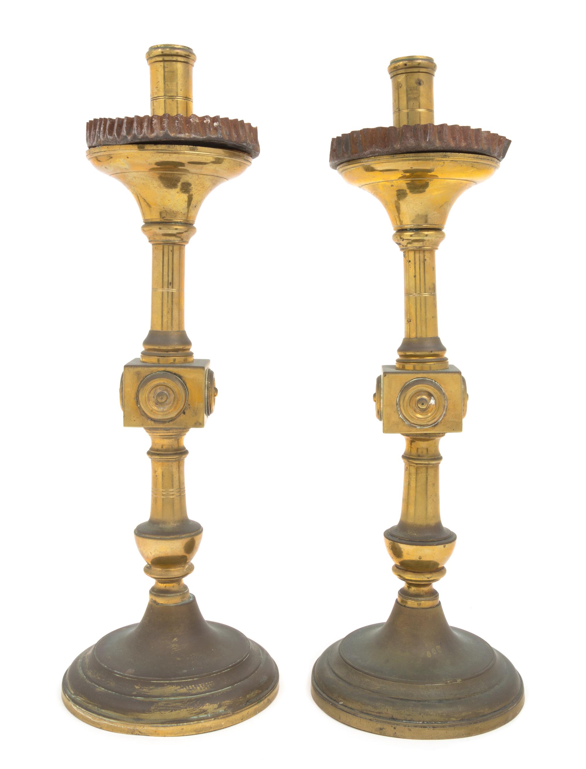 A Pair of Gothic Style Brass Prickets Height 19 inches.