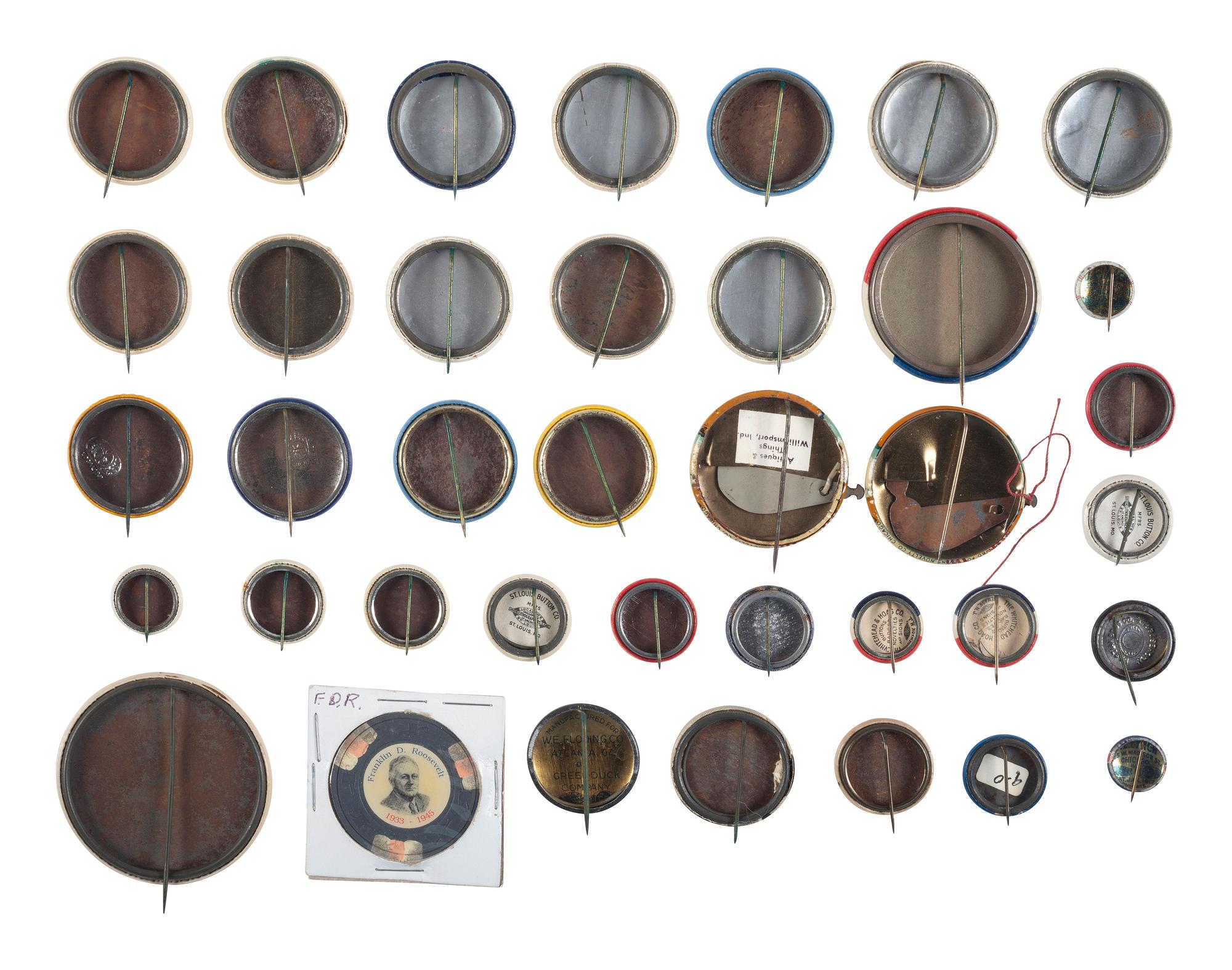 [POLITICS]. A group of 38 political buttons involving Franklin D. Roosevelt, James M. Cox, Harry Truman, and World War II efforts.