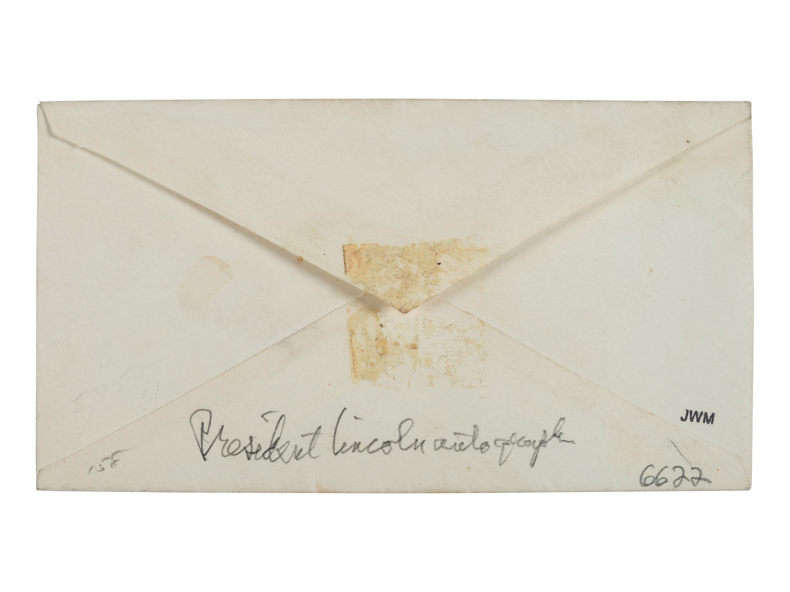 LINCOLN, Abraham (1809-1865). Autograph envelope addressed to Secretary of Navy [Gideon Welles] in Lincoln's hand.