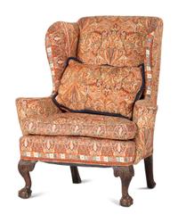 A George III Carved Walnut Claw-and-Ball Foot Easy Chair