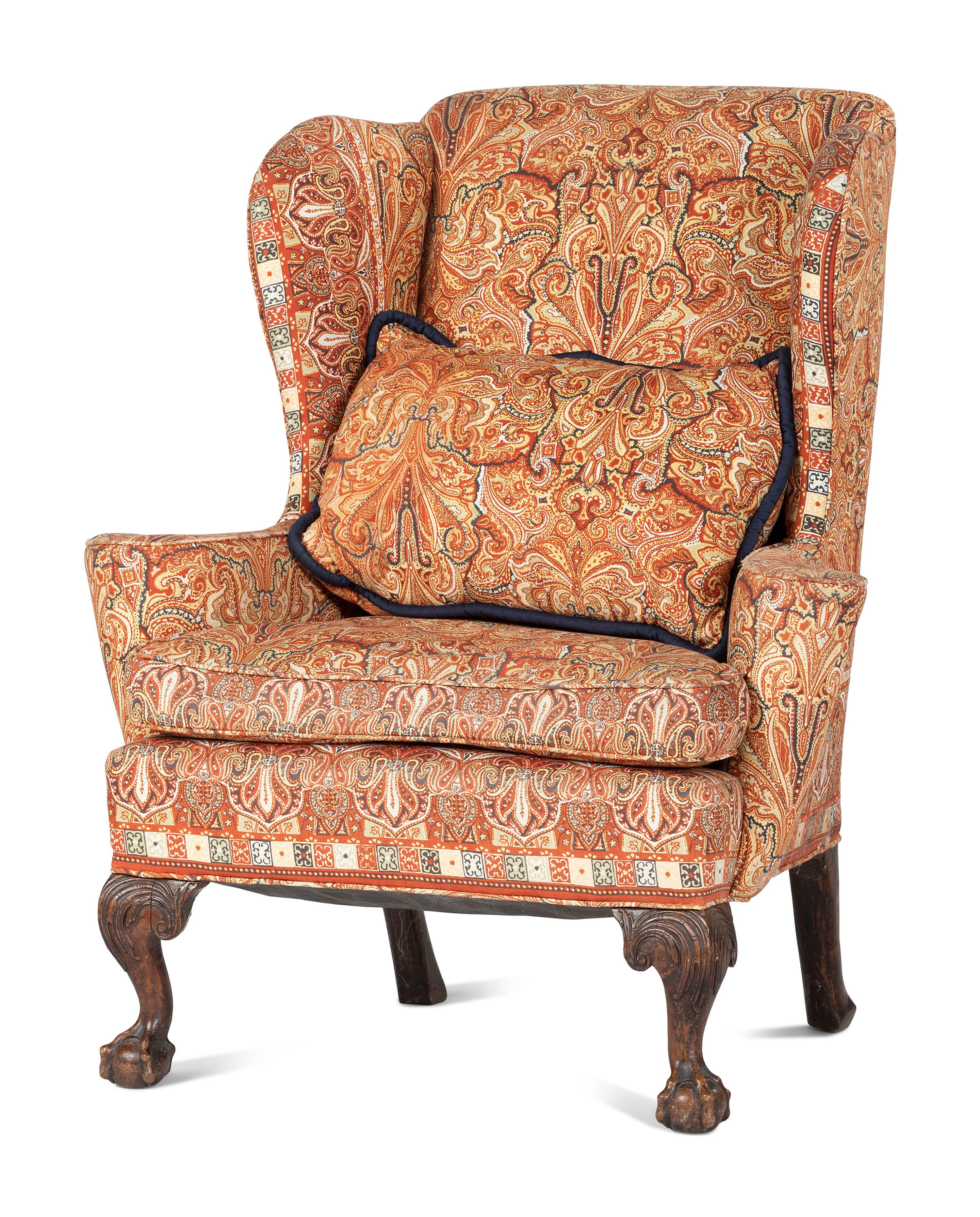 A George III Carved Walnut Claw-and-Ball Foot Easy Chair