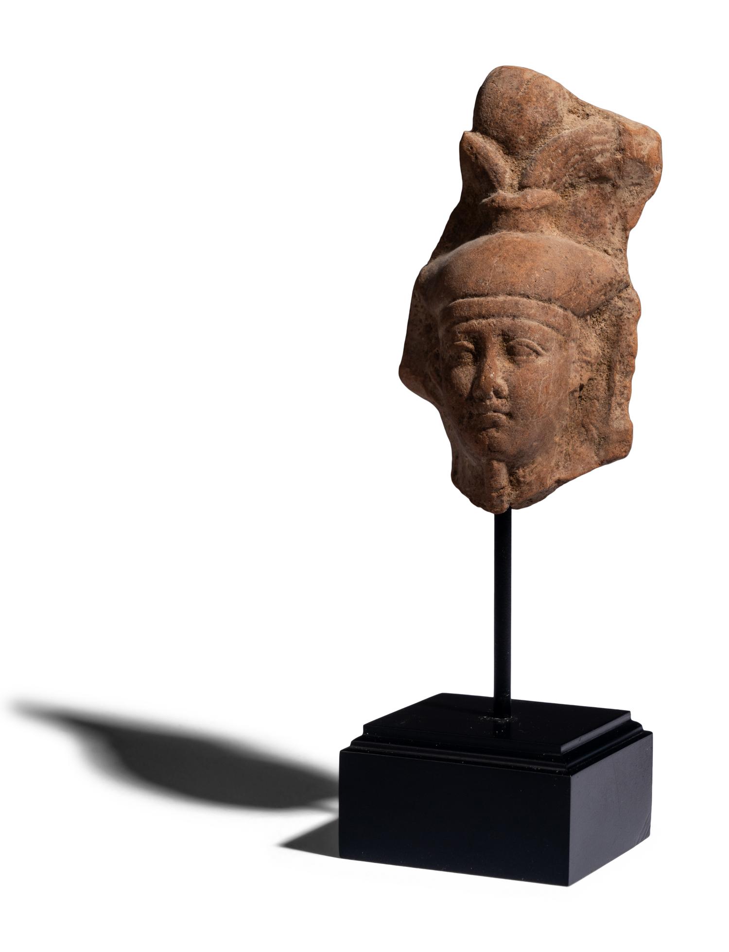 An Egyptian Terracotta Head of the God Osiris