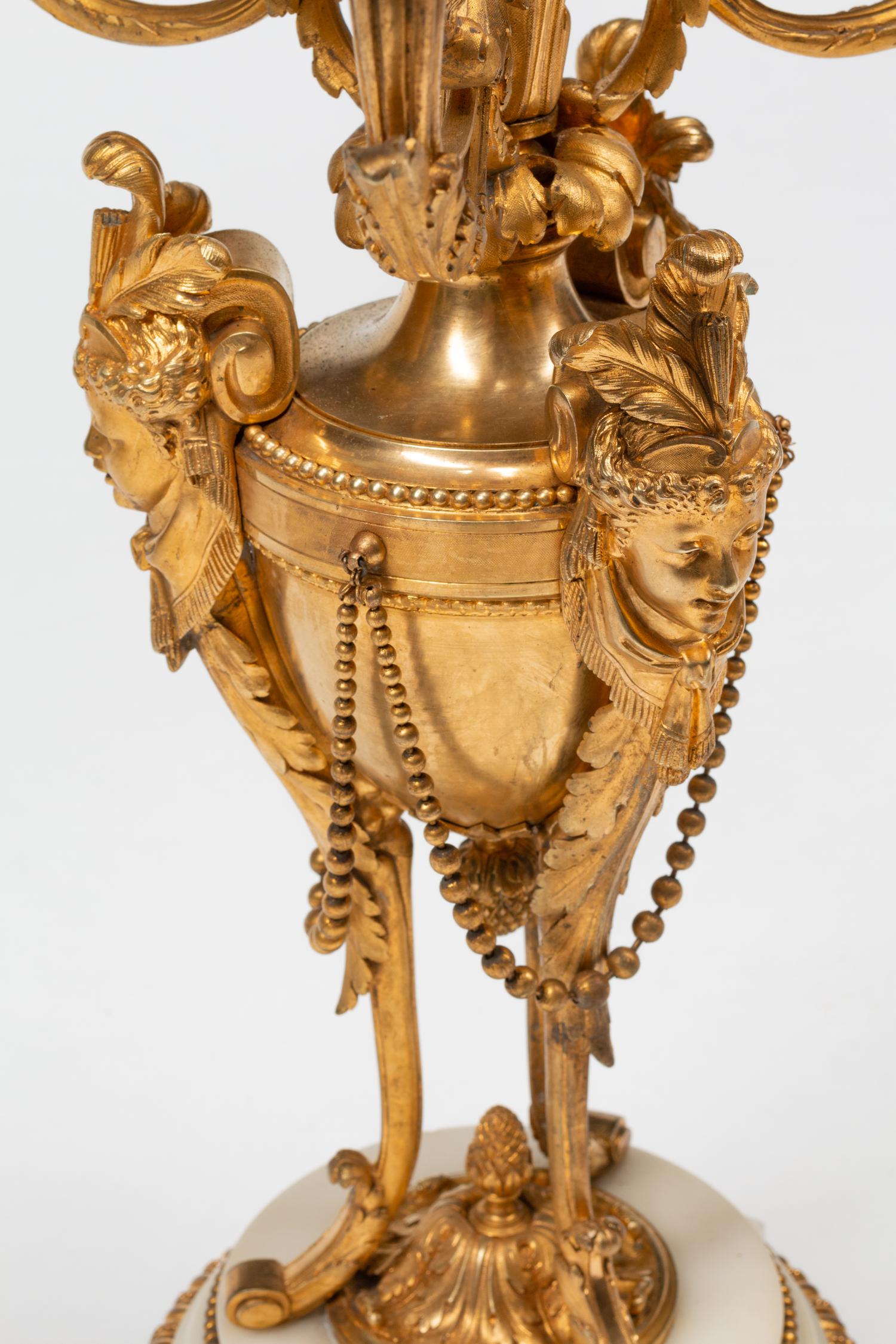 A Pair of Louis XVI Style Gilt Bronze and Marble Seven-Light Candelabra