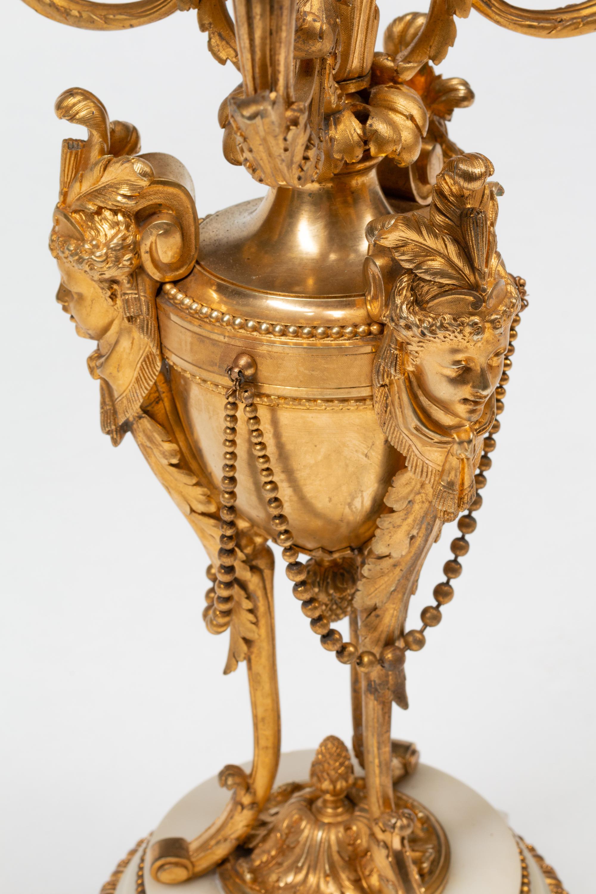 A Pair of Louis XVI Style Gilt Bronze and Marble Seven-Light Candelabra