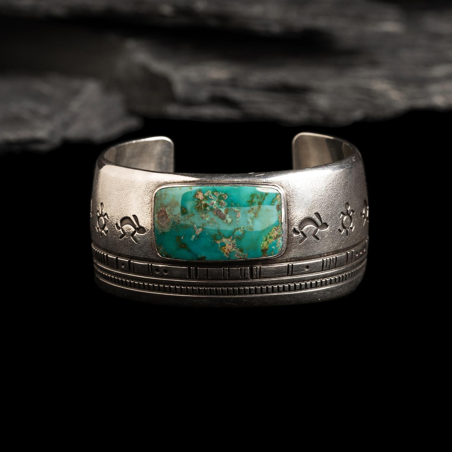 Norbert Peshlakai (Diné, b. 1953) — Silver and Turquoise Cuff Bracelet, with Rabbits