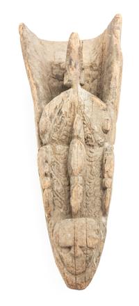 An Oceanic, Sepik River Canoe Prow from Papua New Guinea. Length 23 1/4 x width 10 1/4 x depth 6 1/2 inches.