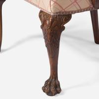 A pair of George II carved walnut armchairs circa 1730