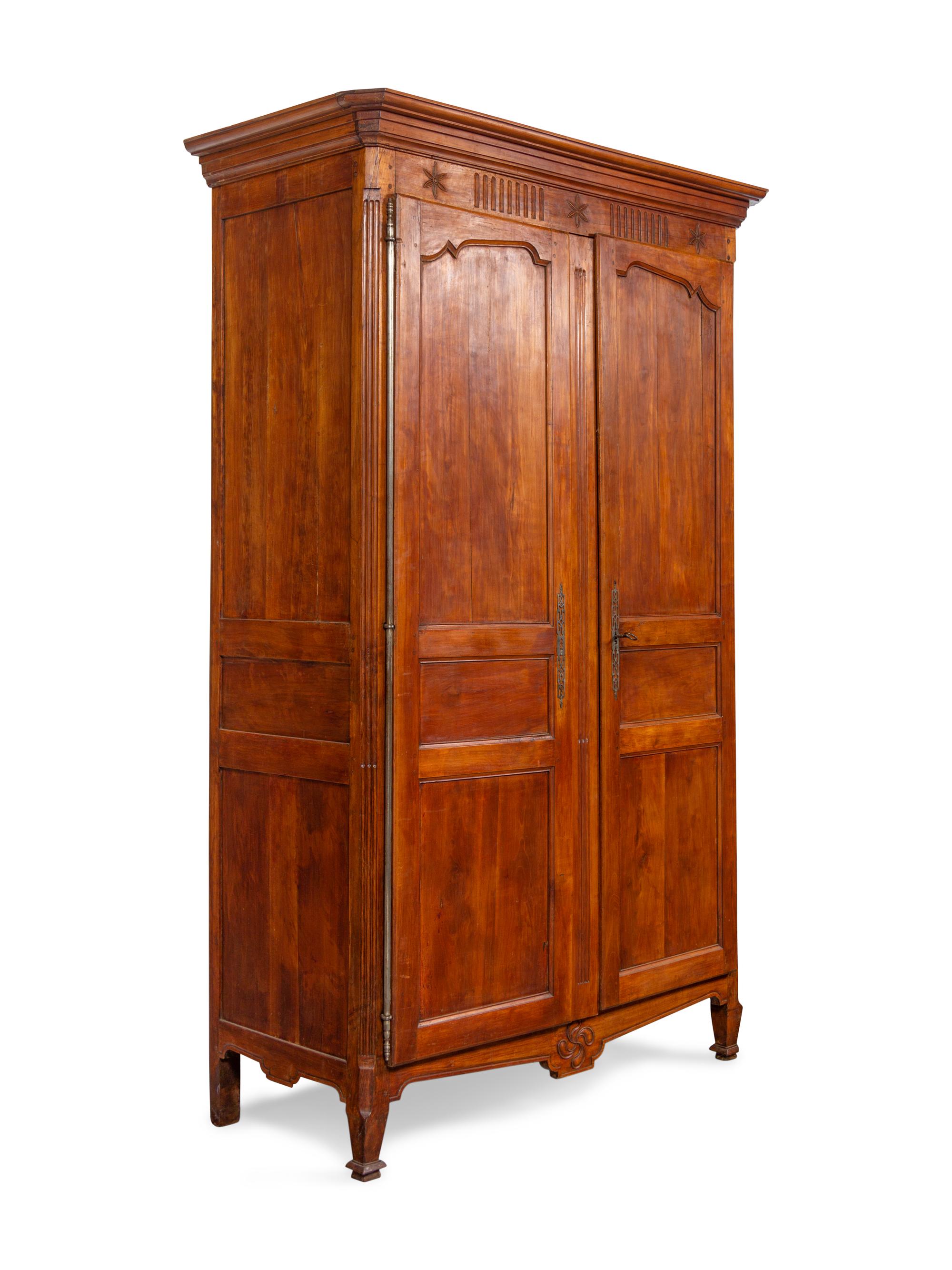 A French Provincial Carved Walnut Armoire