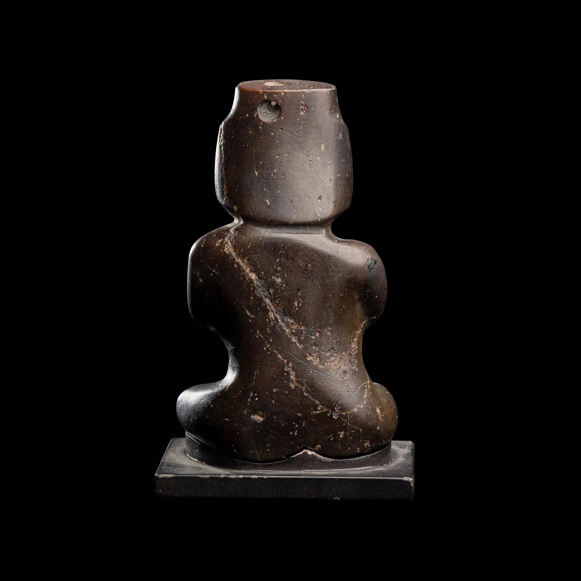 A Group of Twelve Pre-Colombian Style and Near Eastern Style Carved Stone Articles