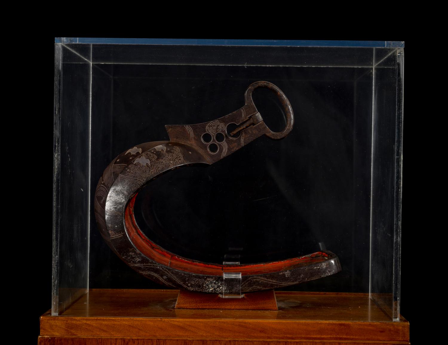 A Japanese Bronze Stirrup in a Walnut and Acrylic Pedestal Vitrine