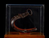 A Japanese Bronze Stirrup in a Walnut and Acrylic Pedestal Vitrine