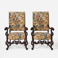 A pair of Baroque Revival carved walnut armchairs late 19th / 20th century