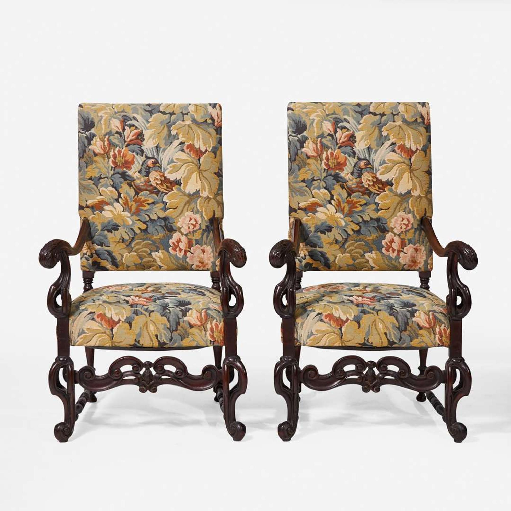A pair of Baroque Revival carved walnut armchairs late 19th / 20th century