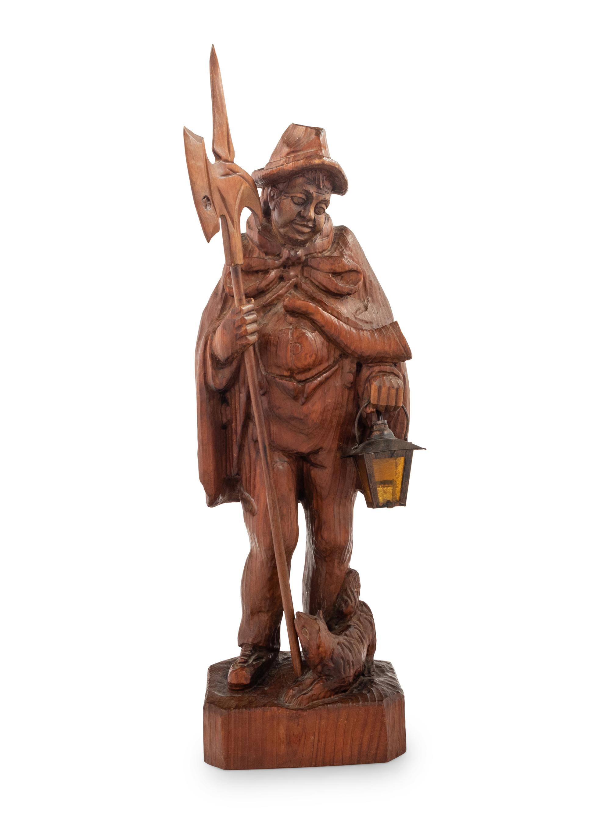 A Black Forest Carved Walnut 'Night Watchman' Lamp