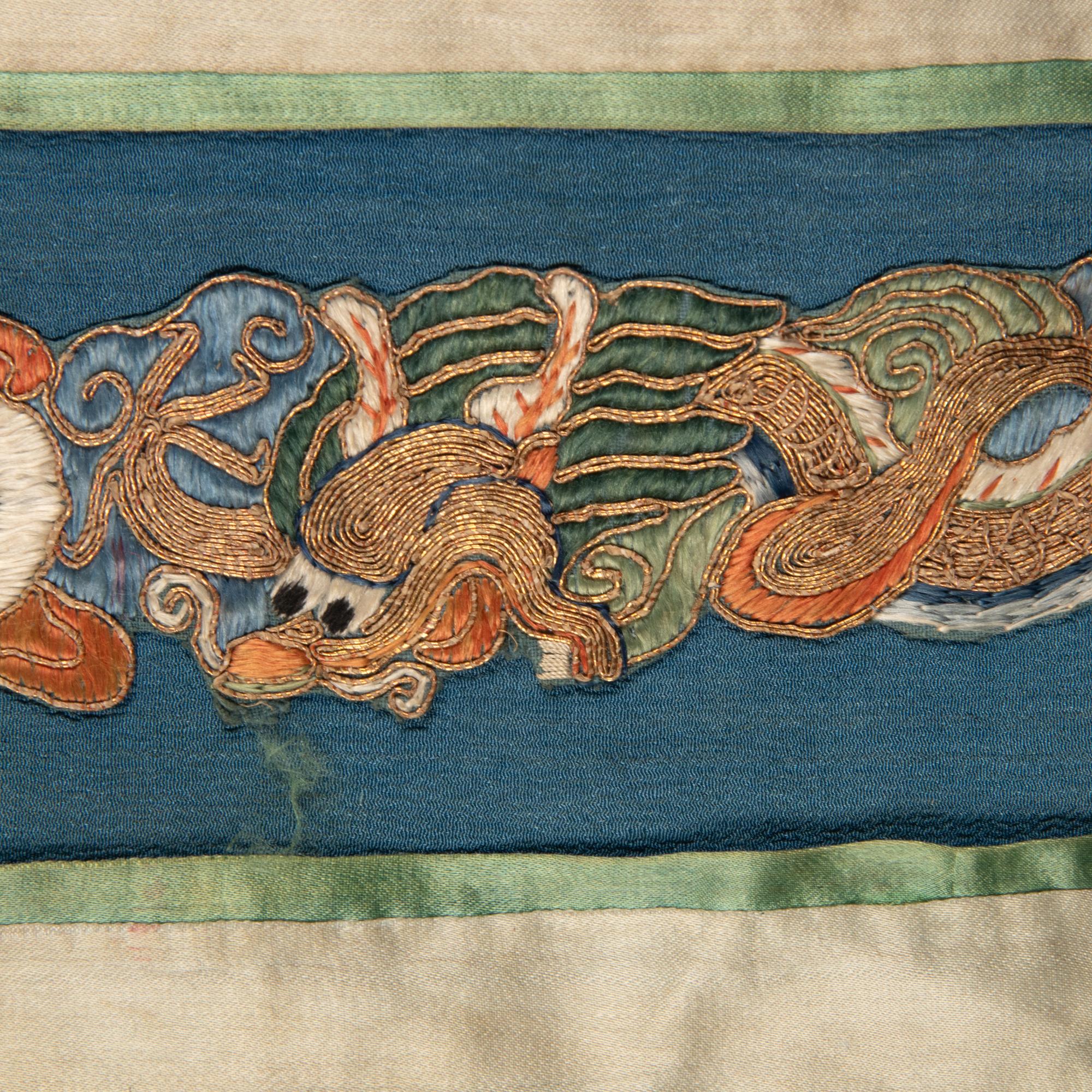Two Chinese Blue Ground Silk Robes, Late Qing Dynasty 清晚期 藍地盤金繡游龍瑞獸纹道袍及藍地織錦女褂