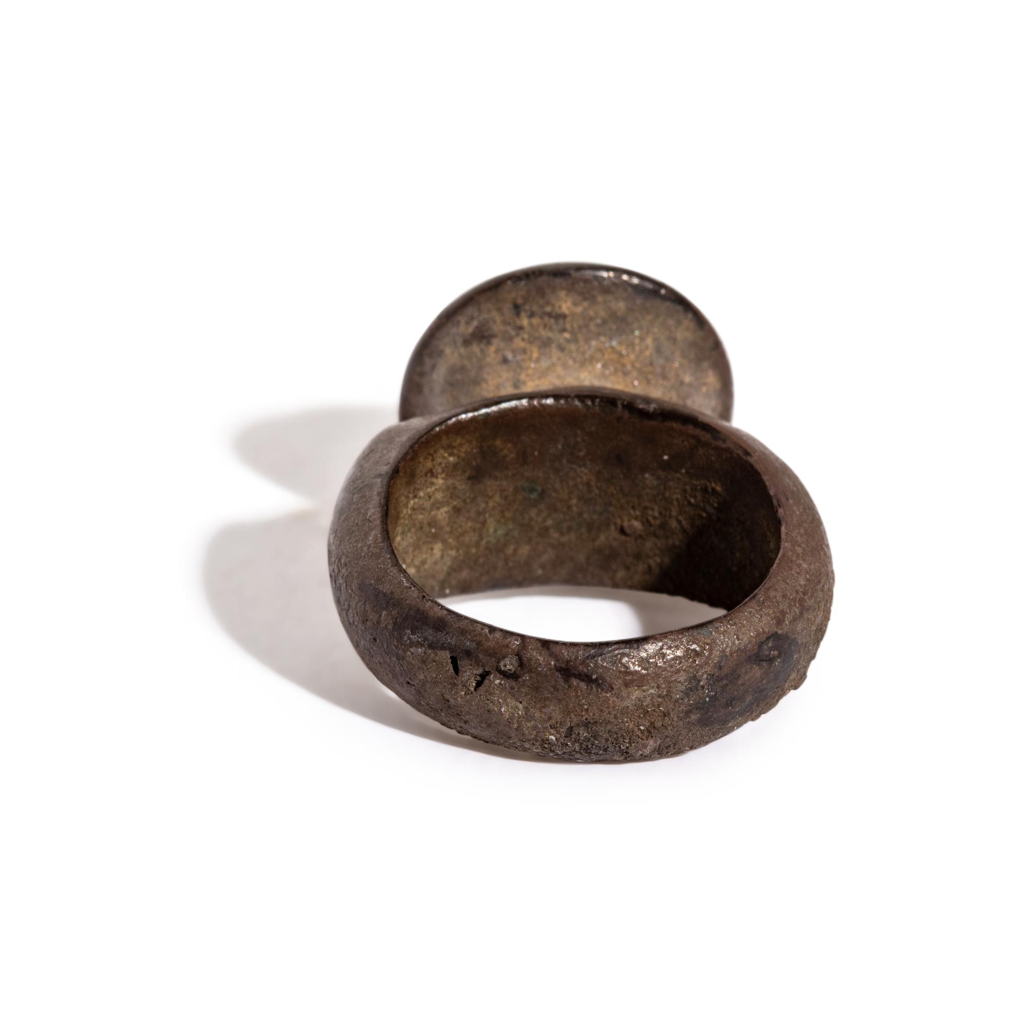 A Roman Gilt-Silver and Garnet Finger Ring with a Ram