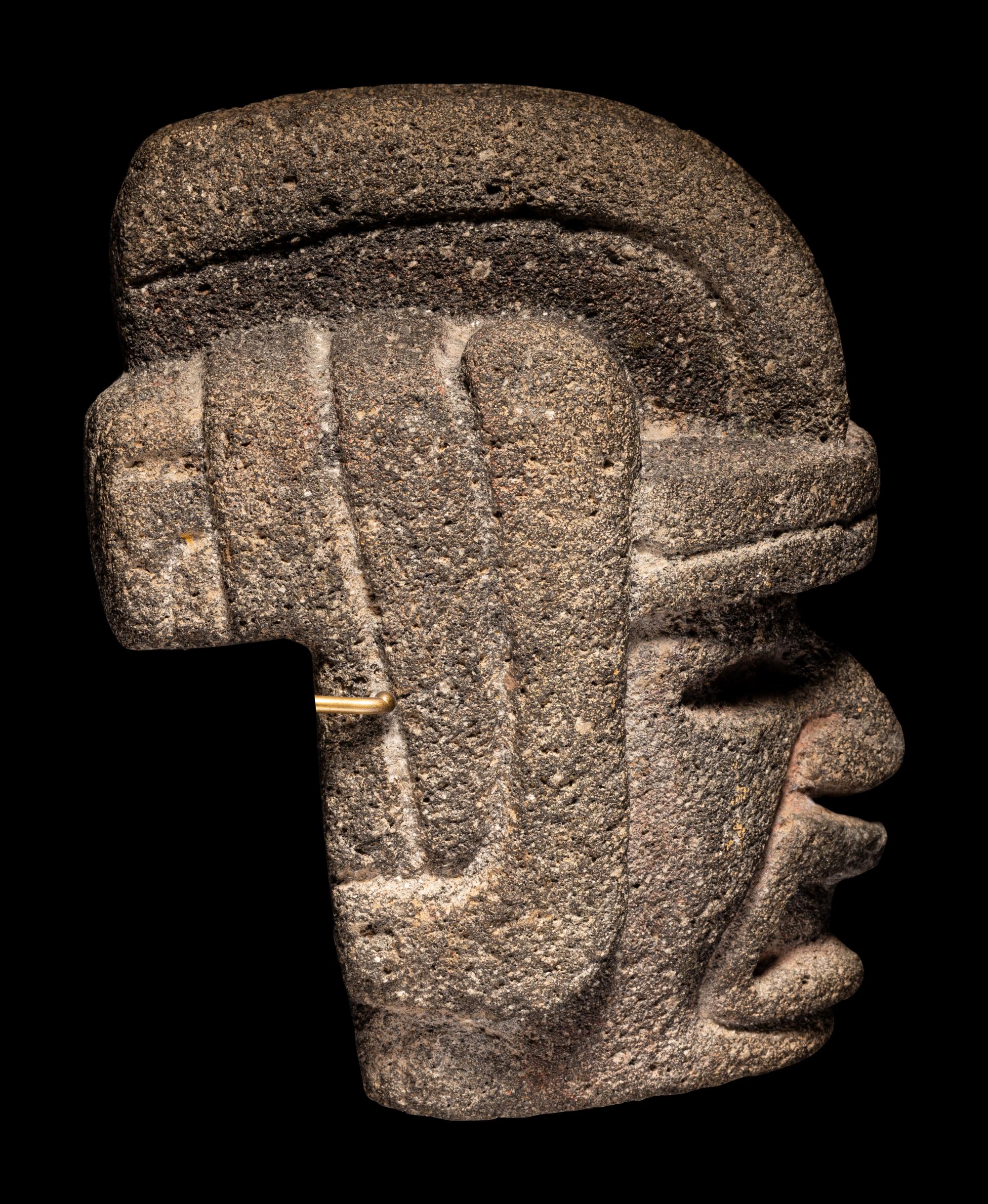 A Veracruz Stone Hacha in the Form of a Warrior