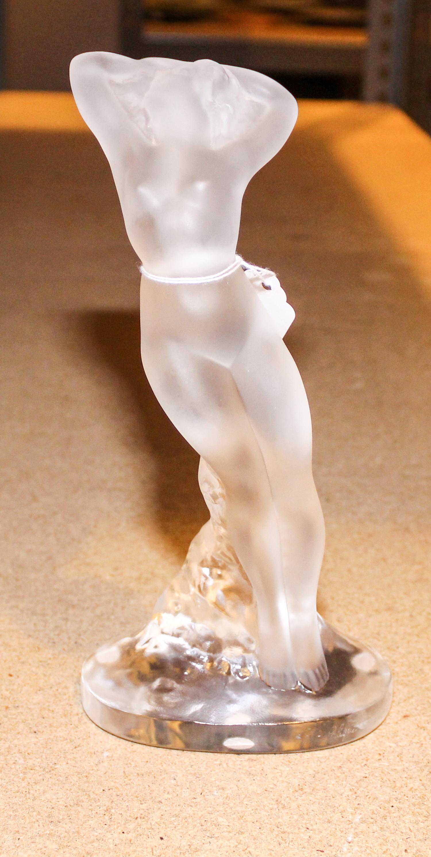 A Lalique Molded and Frosted Glass Figural Group. Height 9 1/4 inches.