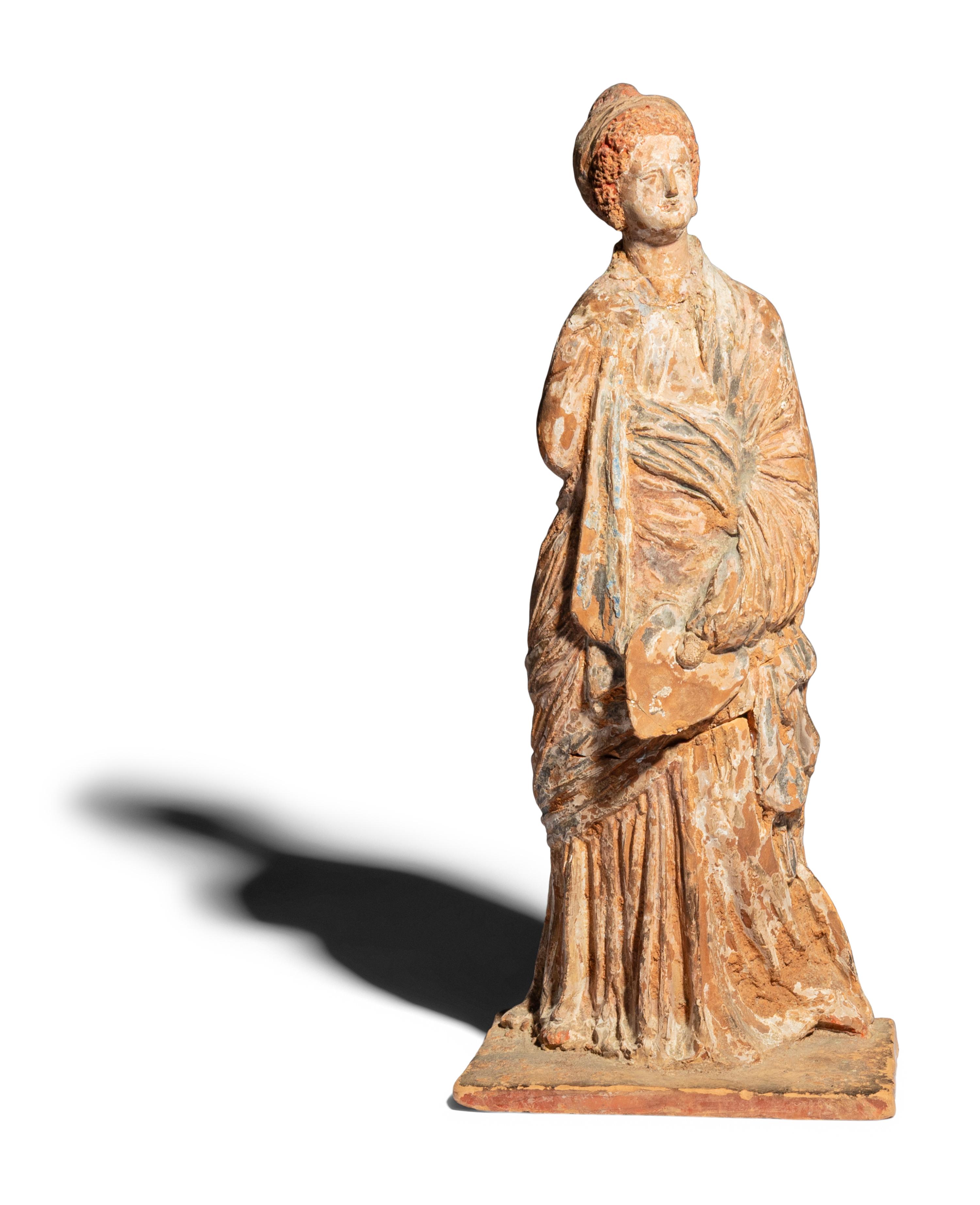 A Neoclassical Terracotta Tanagra Figure