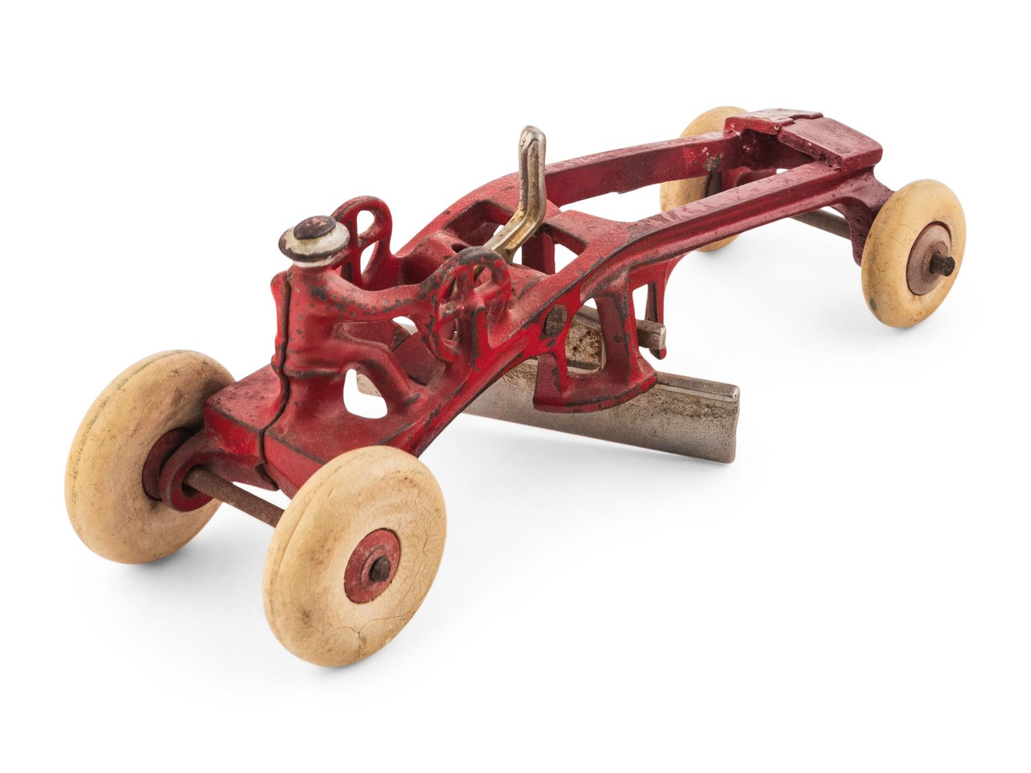 A Kenton Cast Iron Road Grader and Jaeger Cement Mixer