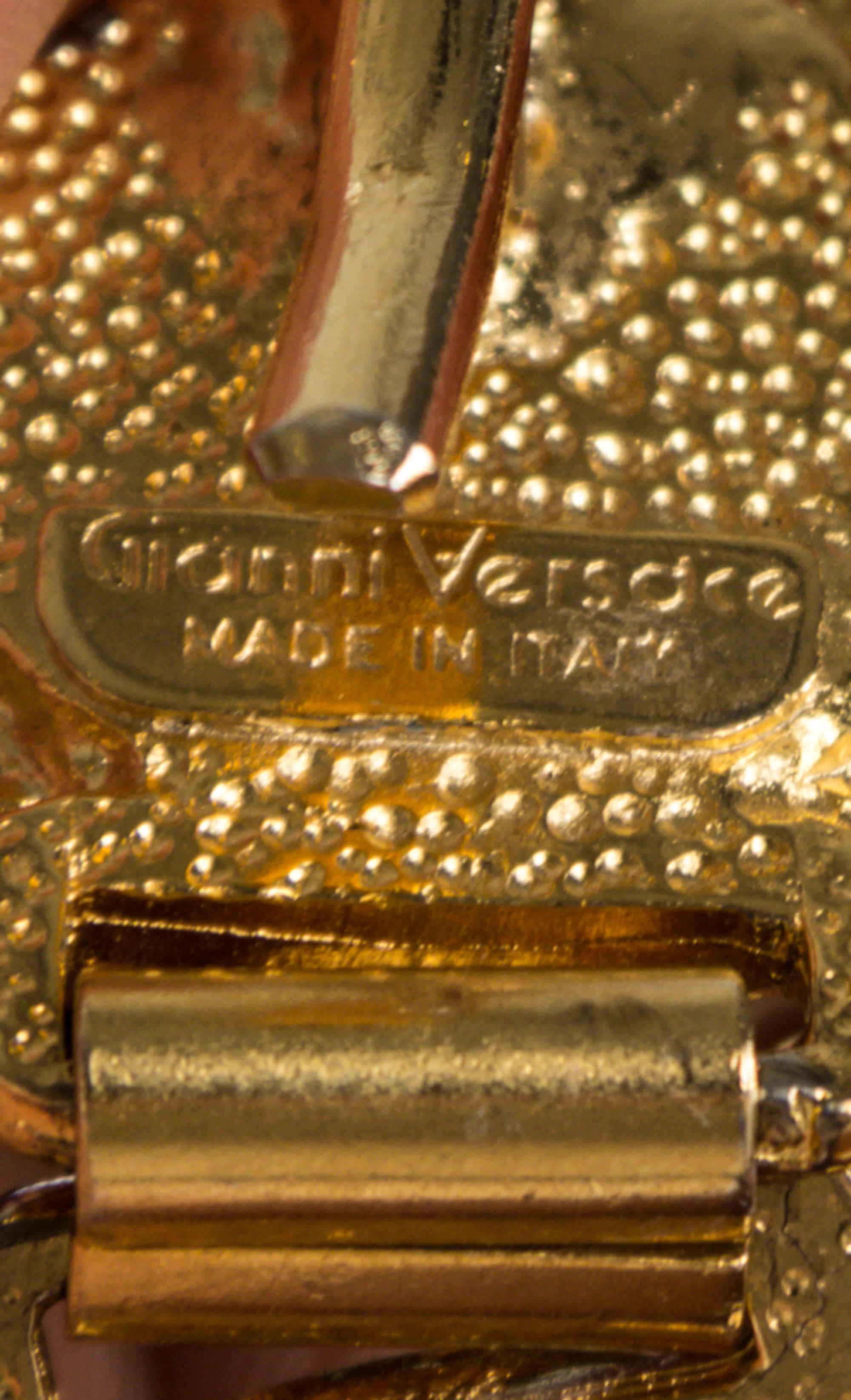 A Gianni Versace Green Embossed Medusa Link Belt, 31.25" x 1".
