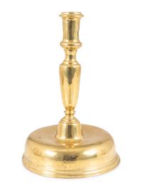 A Continental Brass Bell-Bottom Candlestick