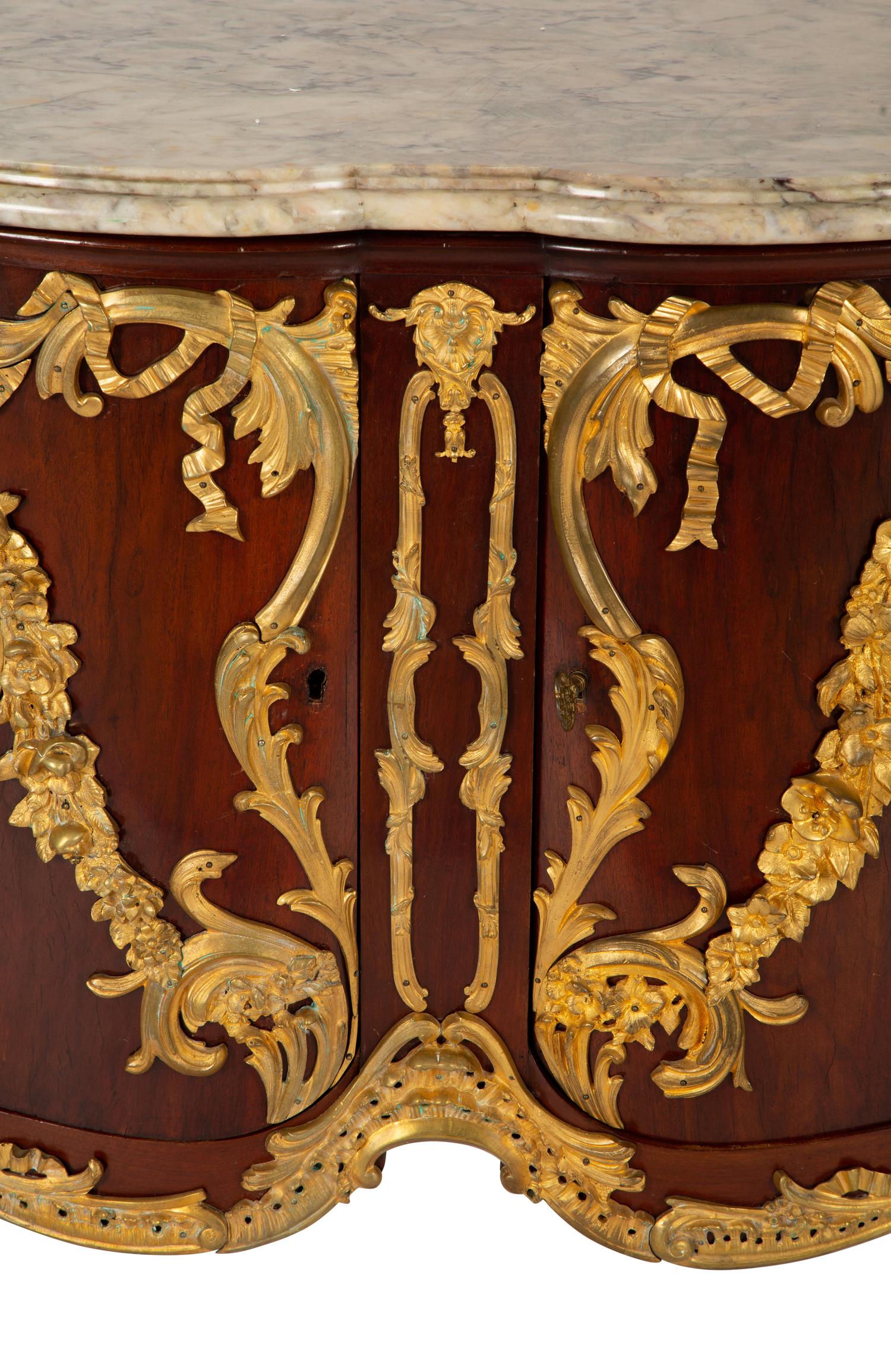 A Régence Style Gilt Bronze Mounted Mahogany Marble-Top Commode — Early 20th century