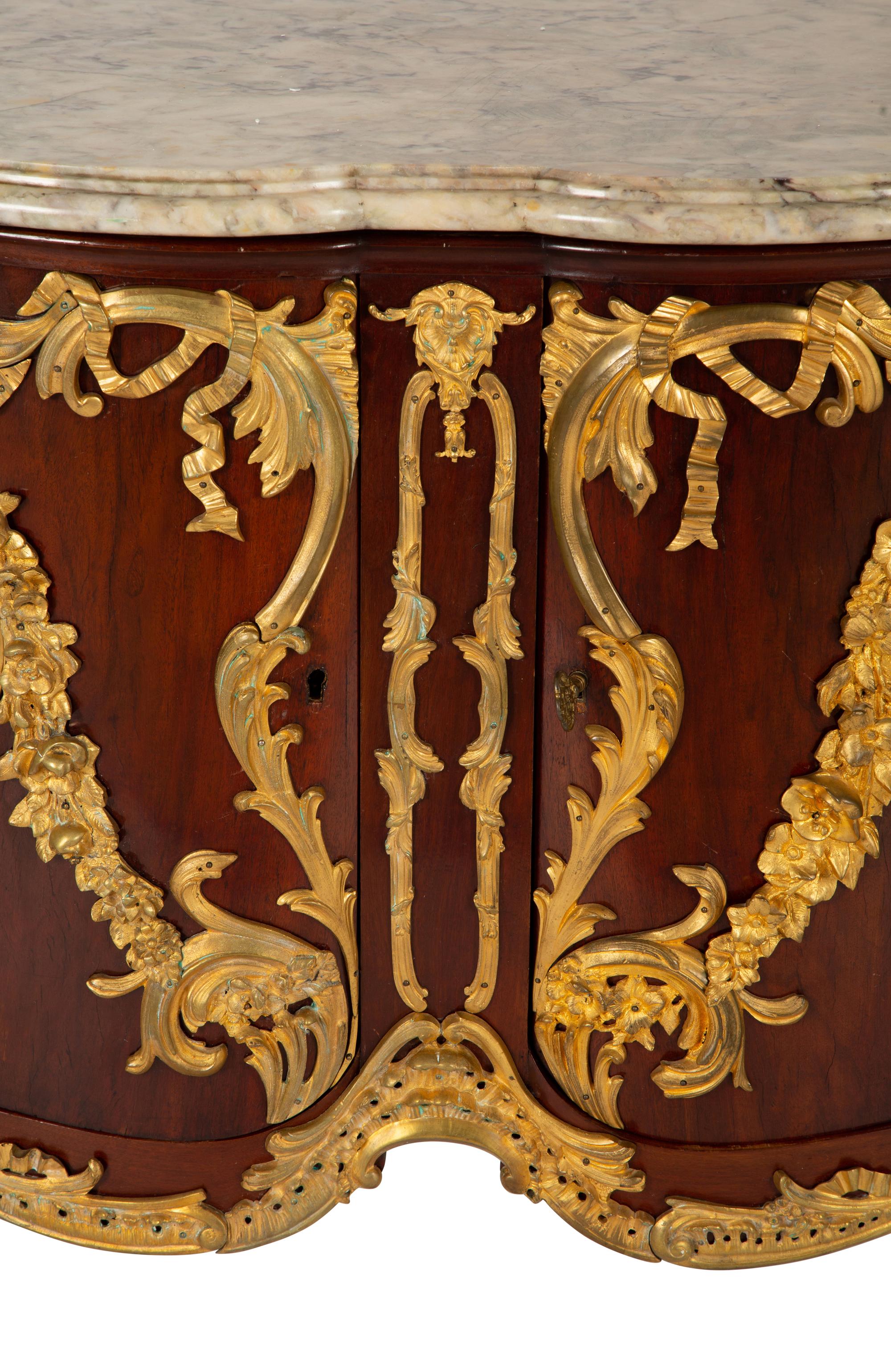 A Régence Style Gilt Bronze Mounted Mahogany Marble-Top Commode — Early 20th century