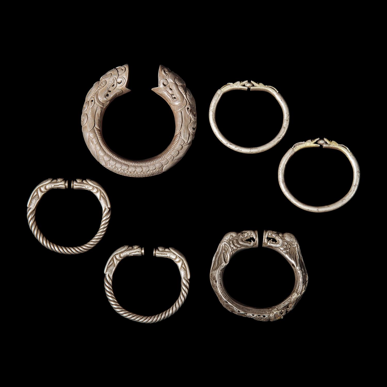 Six Chinese Silver 'Dragon' Bracelets, Qing Dynasty 清 銀龍頭紋鐲六隻