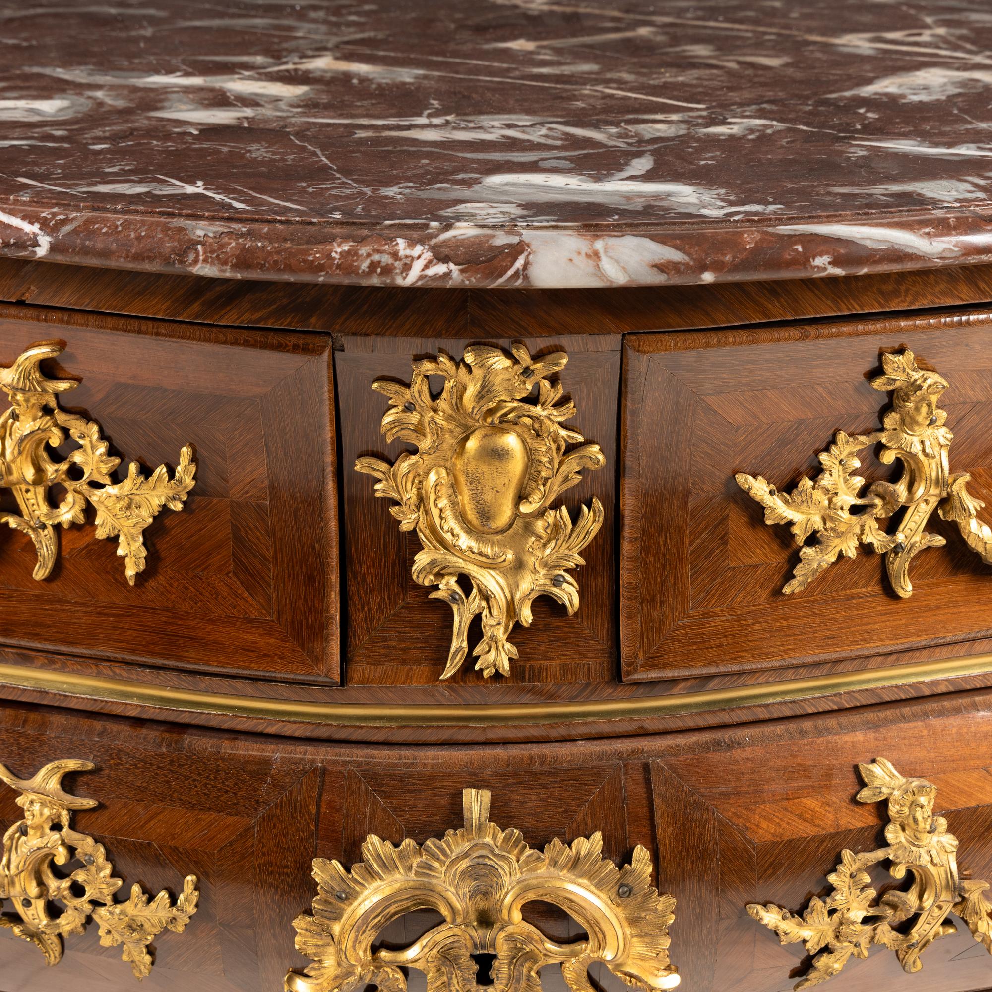 A Louis XV Kingwood Parquetry and Gilt Bronze Mounted Marble-Top Commode