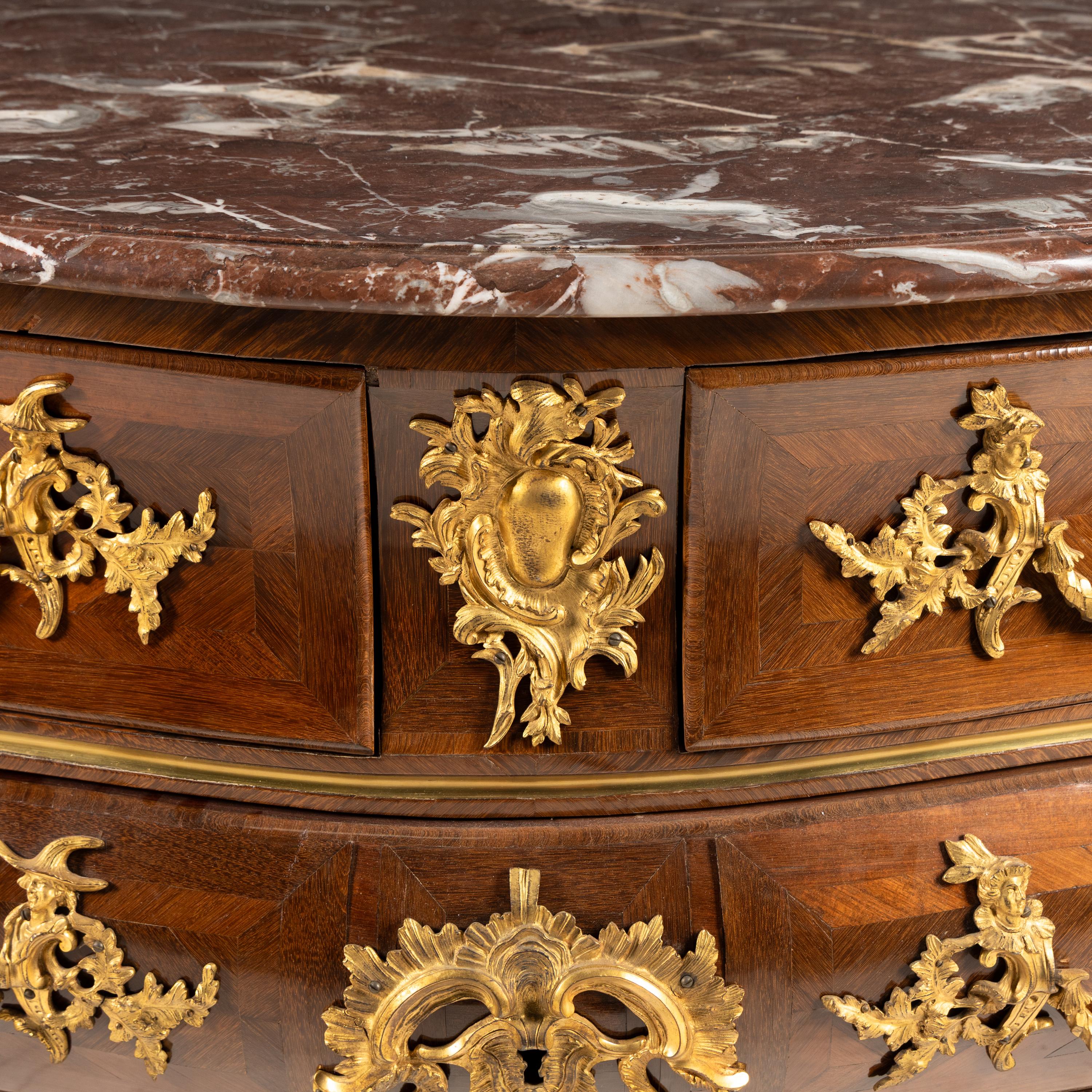 A Louis XV Kingwood Parquetry and Gilt Bronze Mounted Marble-Top Commode