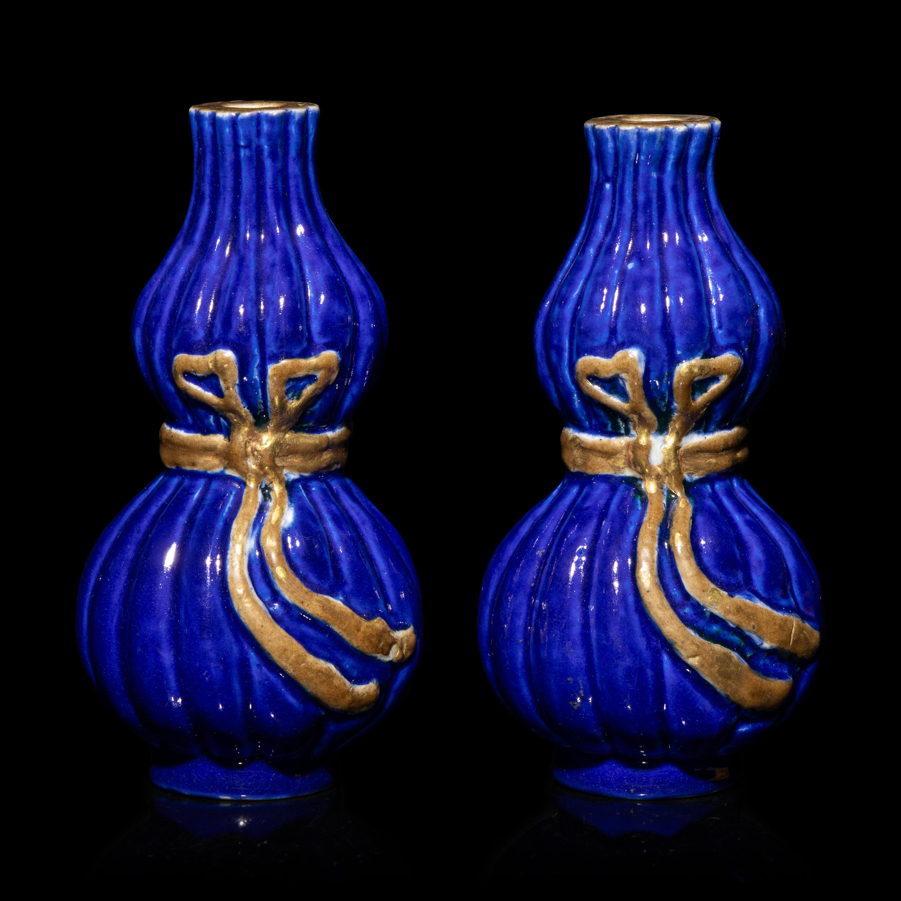 A Pair of Chinese Gilt Decorated Blue Glazed Porcelain Gourd Vases, 20th Century — 霽藍釉描金葫蘆式包袱瓶一對