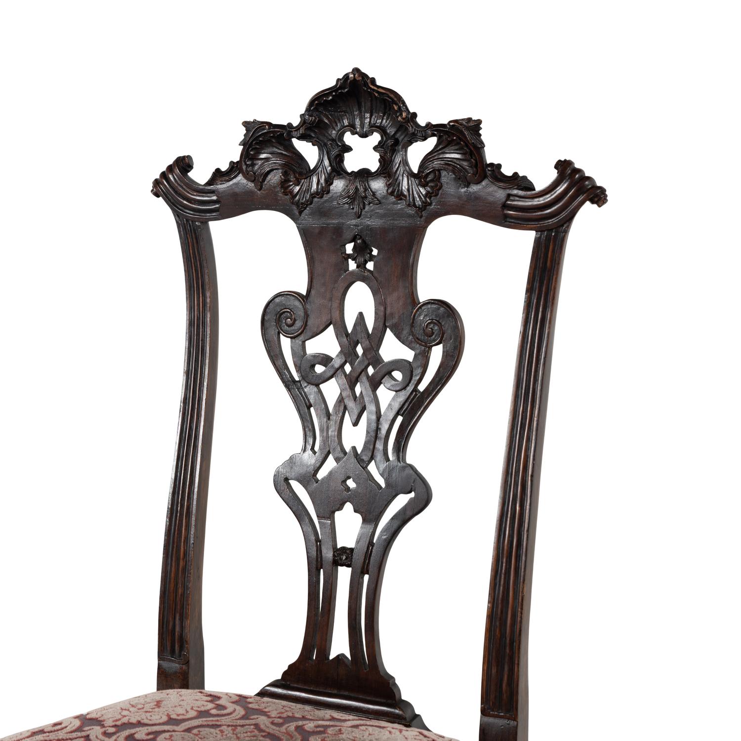 An Italian Rococo Style Carved Mahogany Nine-Piece Seating Suite