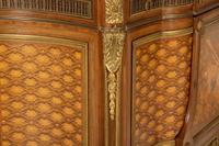 A Louis XVI Style Gilt Bronze Mounted Kingwood and Marquetry Marble-Top Commode