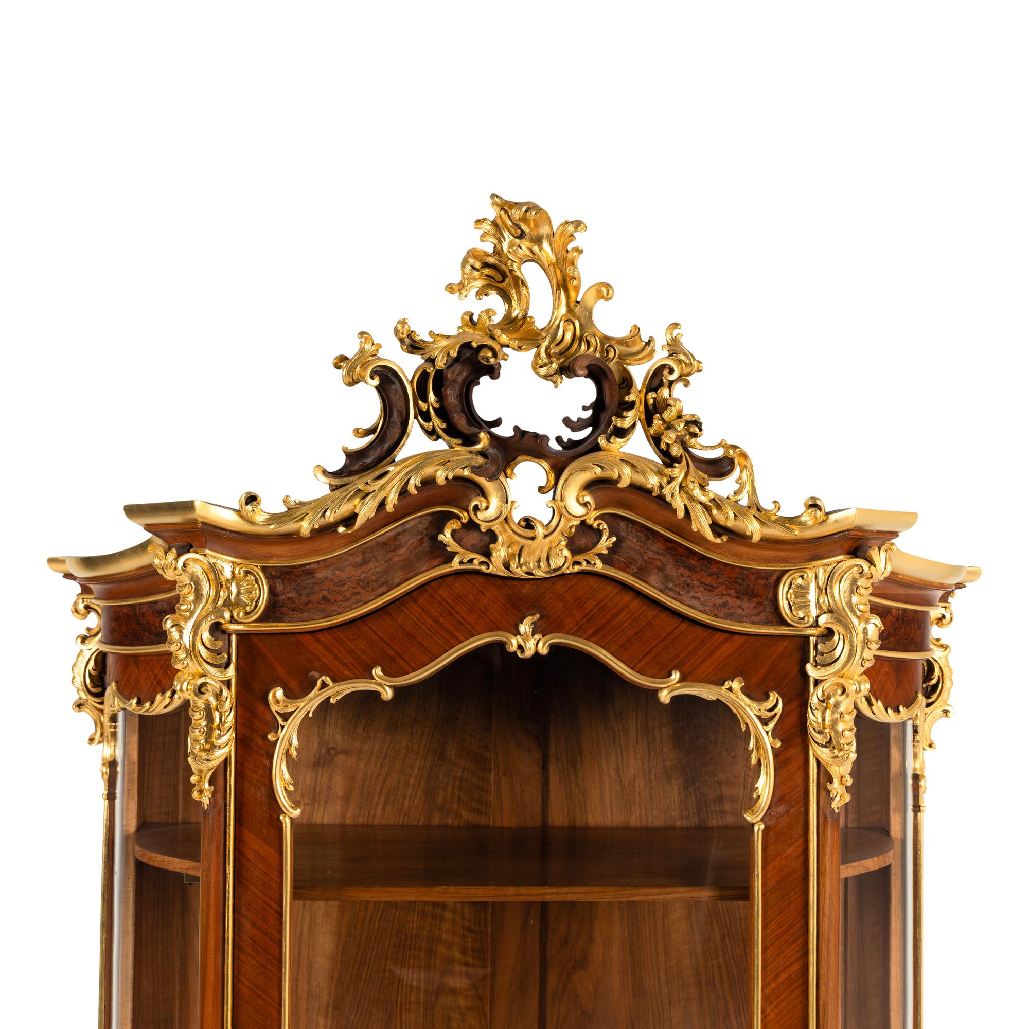 A Louis XV Style Parcel Gilt Mahogany Cabinet à Deux Corps