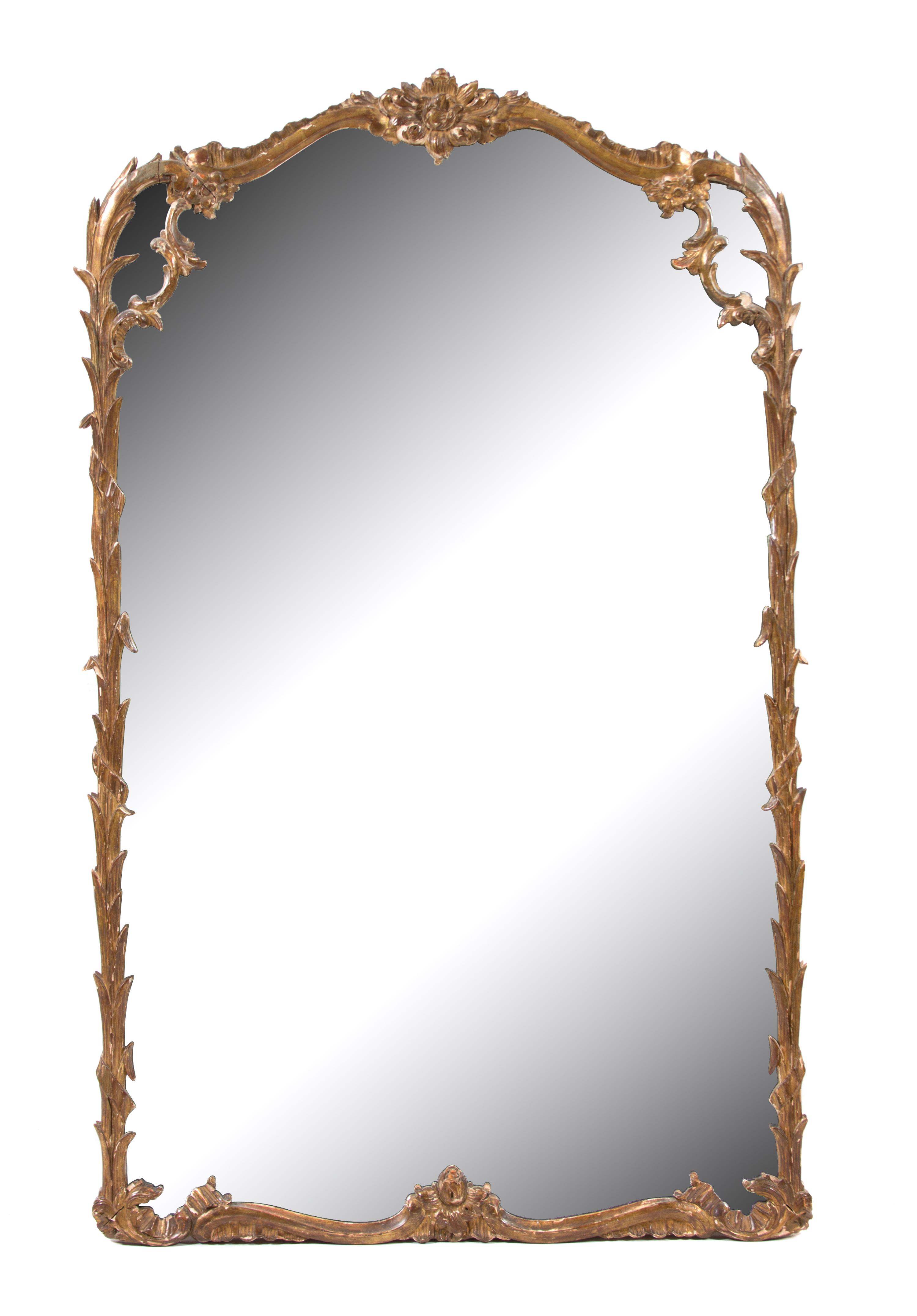 A Foliate Carved Giltwood Framed Mirror Height 53 x width 33 inches. — 19TH CENTURY