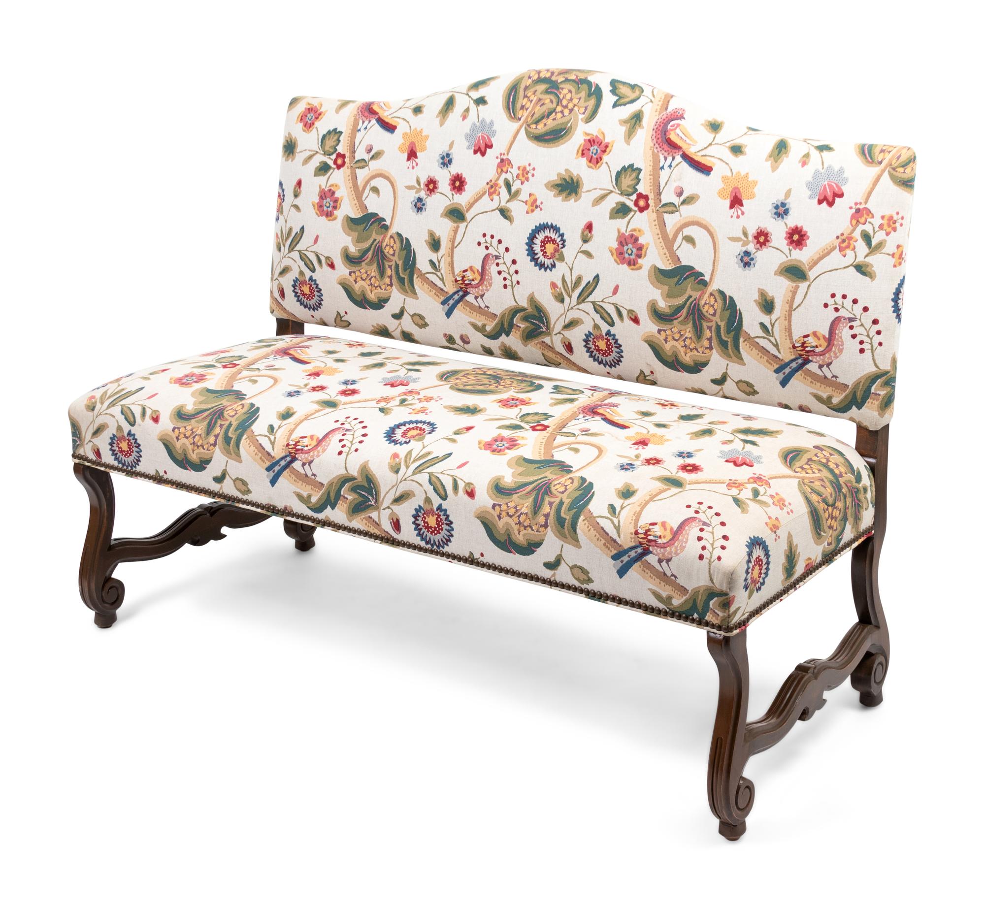 A Louis XIV Style Walnut Bench with Faux Crewelwork Upholstery