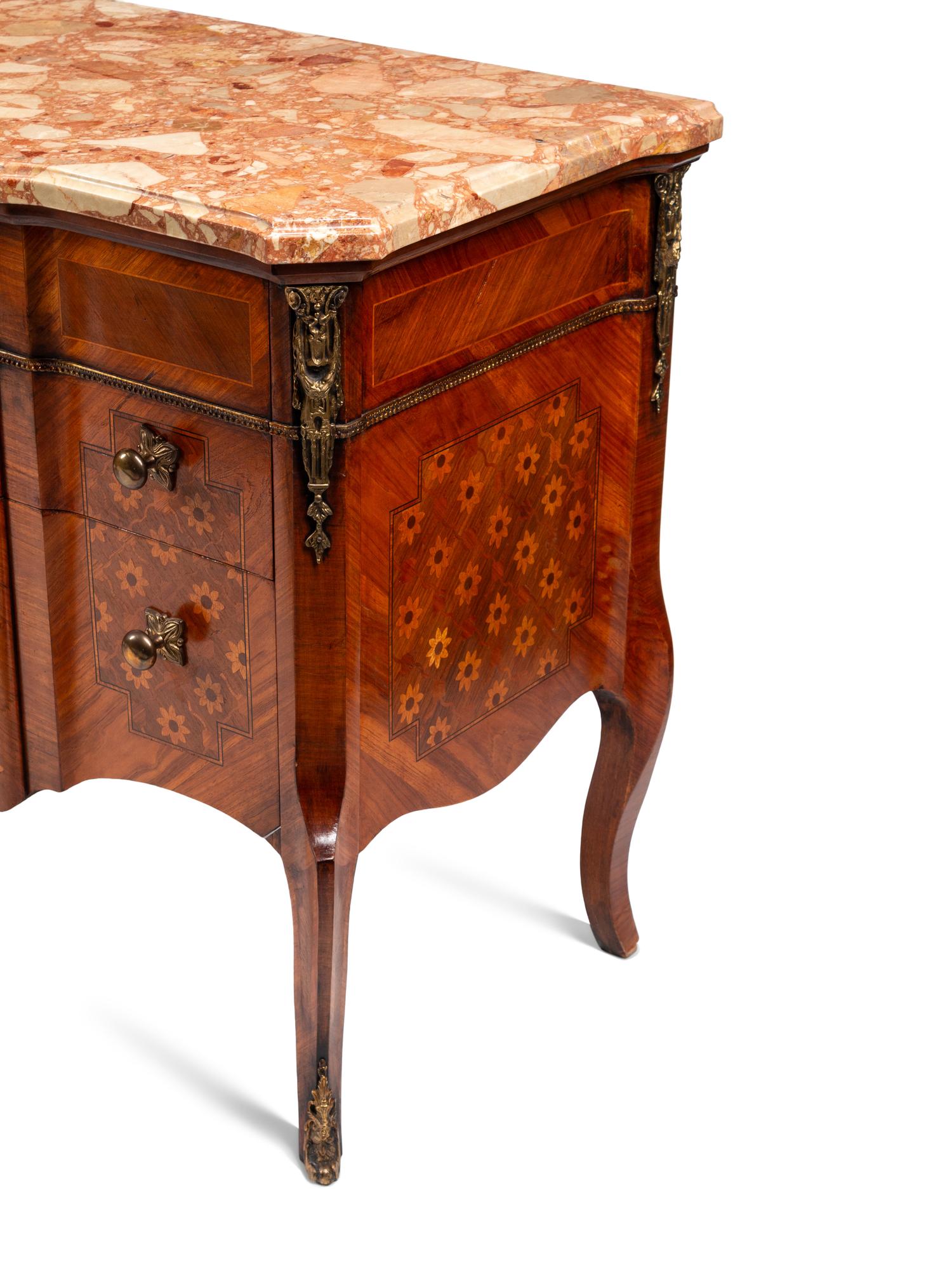 A Pair of Late Louis XV Style Gilt Bronze Mounted Marquetry Marble-Top Commodes