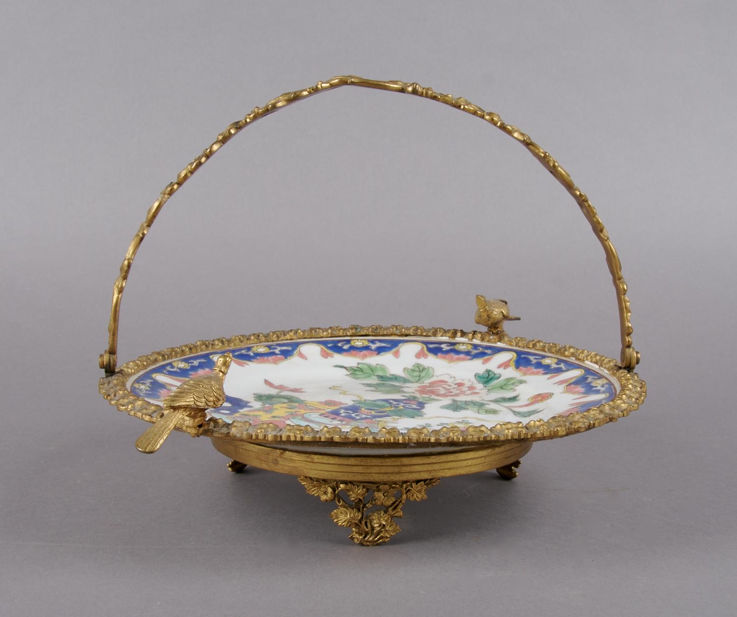 A Gilt Metal Mounted Porcelain Plate, Diameter of plate 11 inches