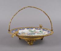 A Gilt Metal Mounted Porcelain Plate, Diameter of plate 11 inches