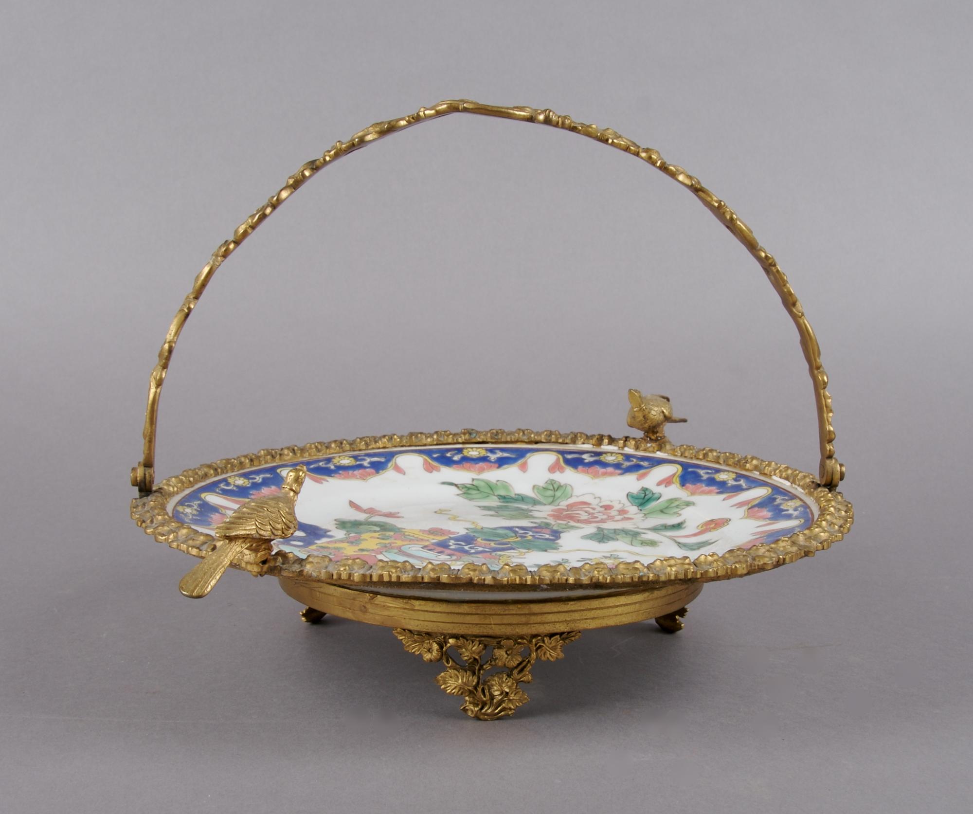 A Gilt Metal Mounted Porcelain Plate, Diameter of plate 11 inches