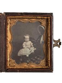 [EARLY PHOTOGRAPHY]. Sixth plate daguerreotype of white child being held by partially obscured African American woman.