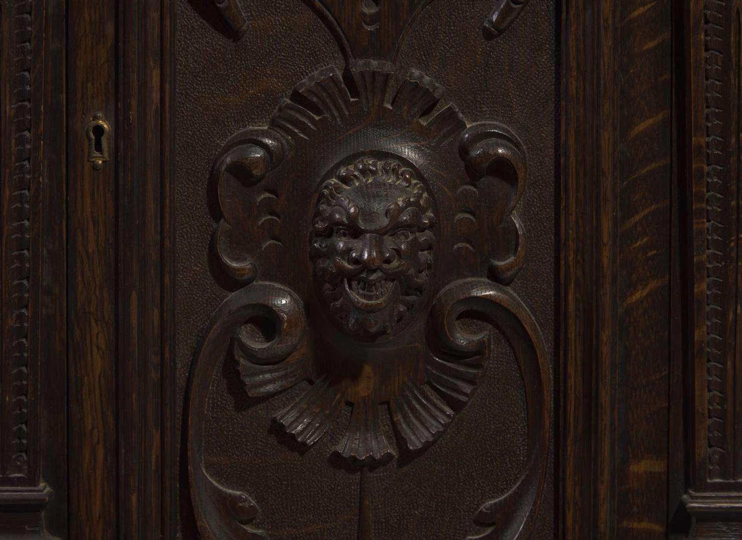 An impressive Renaissance Revival carved oak tall case clock, the case attributed to R.J. Horner & Co., New York, NY, with works by Winterhalder & Hofmeier, Schwaerzenbach, Black Forest, Germany, retailed by Tilden Thurber Co., Providence, RI, late 19th / early 20th century