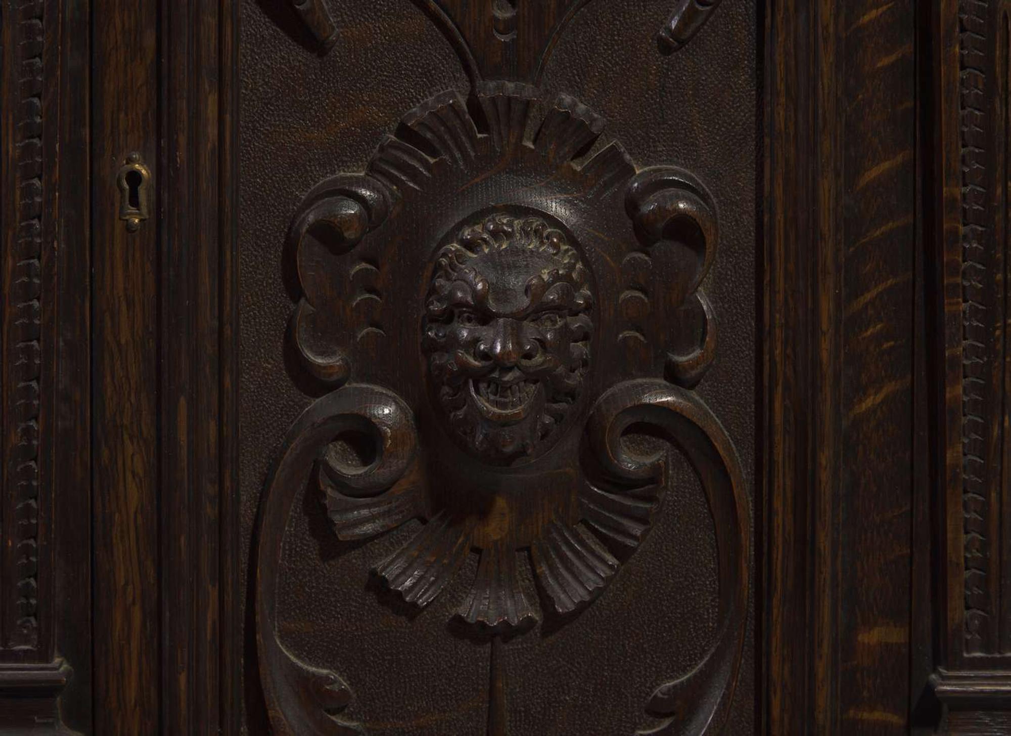 An impressive Renaissance Revival carved oak tall case clock, the case attributed to R.J. Horner & Co., New York, NY, with works by Winterhalder & Hofmeier, Schwaerzenbach, Black Forest, Germany, retailed by Tilden Thurber Co., Providence, RI, late 19th / early 20th century