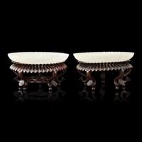 A Pair of Chinese White Jade 'Chrysanthemum' Dishes, Qing Dynasty to Republic Period 晚清-民國 白玉菊瓣盤一對