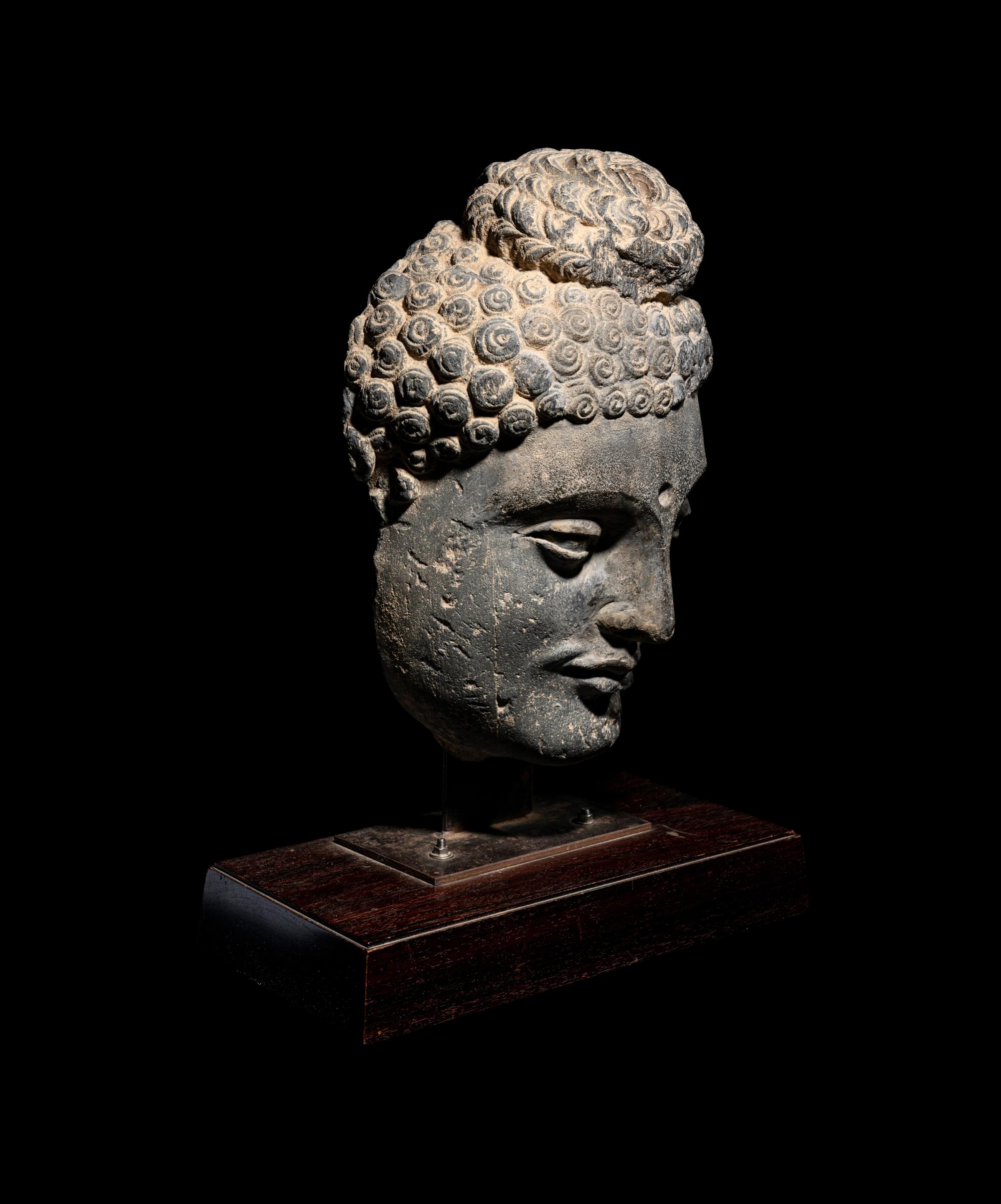 A Gandharan Grey Schist Buddha Head