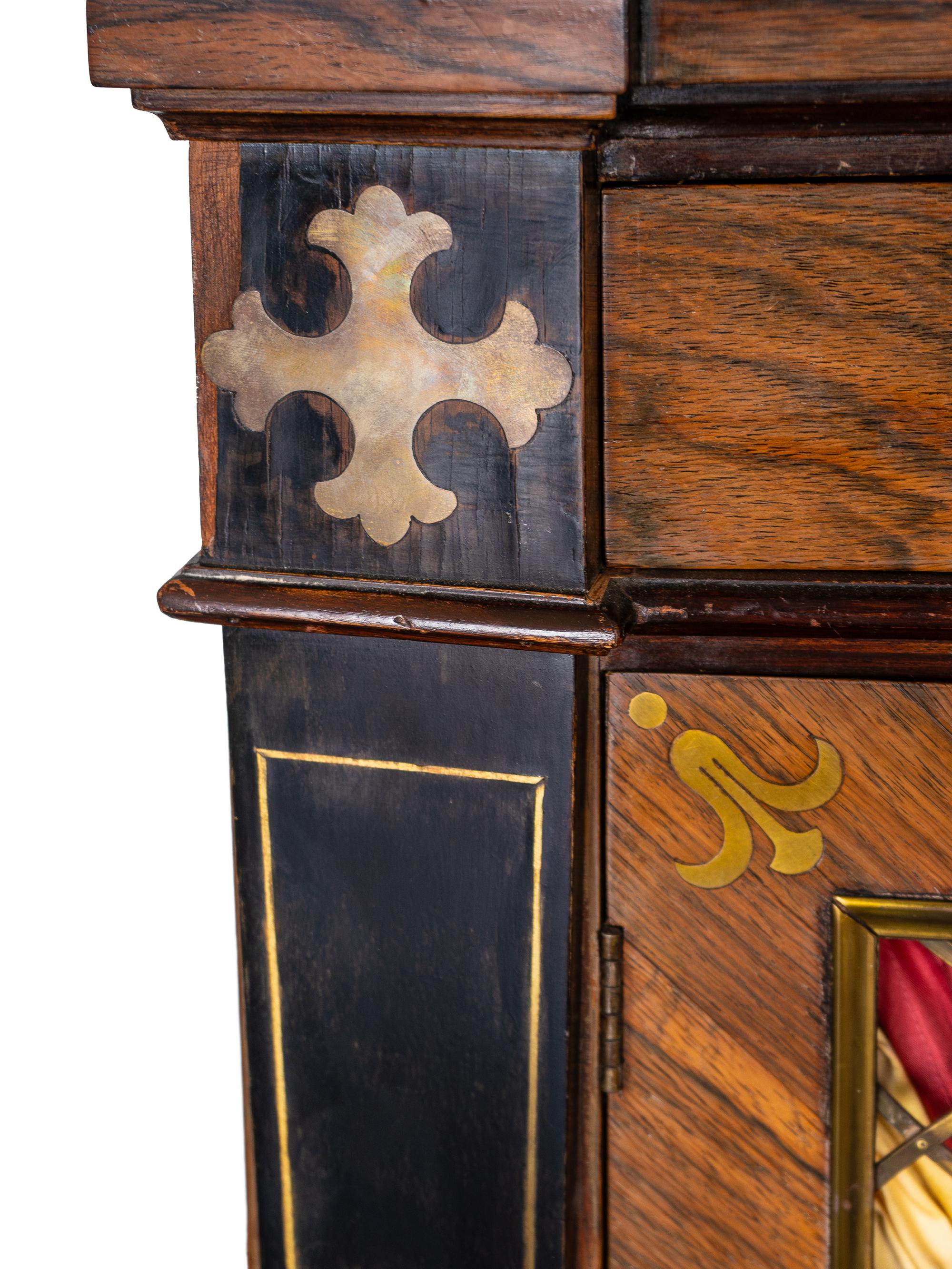 A Regency Style Parcel Ebonized Rosewood and Brass Inlaid Chiffonier