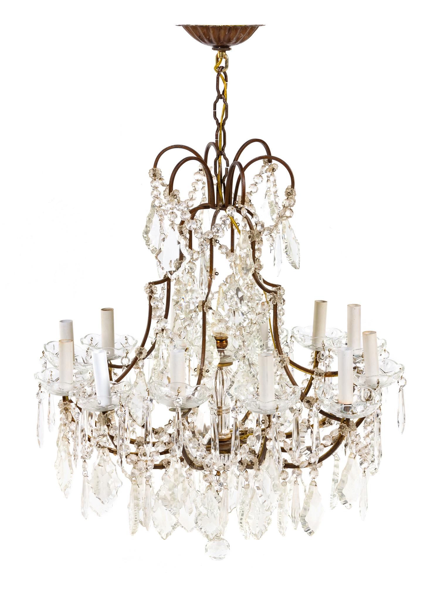 A French Bronze Twelve-Light Chandelier Height 34 1/2 x diameter 23 1/4 inches. — FIRST HALF 20TH CENTURY