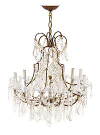 A French Bronze Twelve-Light Chandelier Height 34 1/2 x diameter 23 1/4 inches. — FIRST HALF 20TH CENTURY